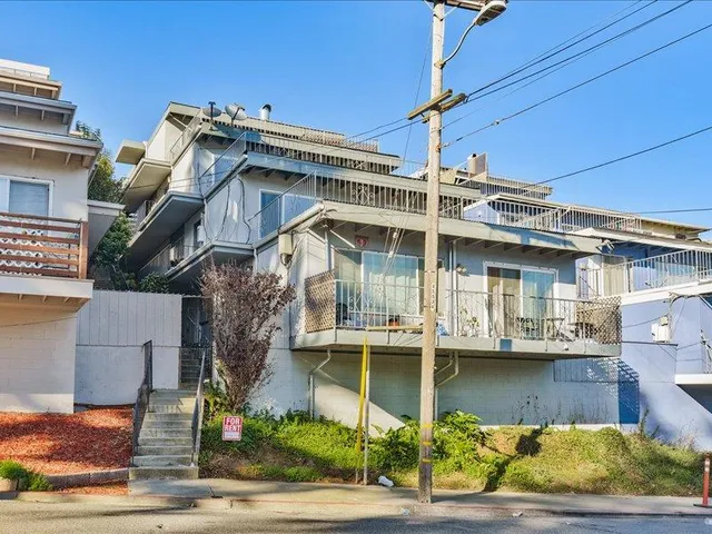 a view of a building with a street