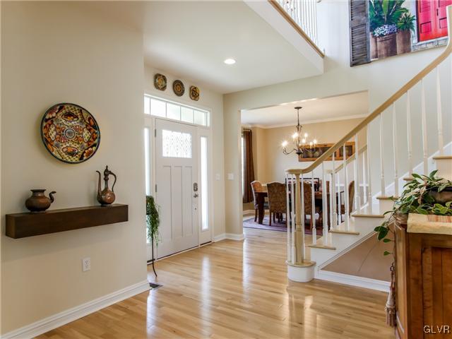 210 West Butternut Road Hellertown, PA 18055 - Photo 8 of 40 a living room with lots of furniture and lots of frames on the wall