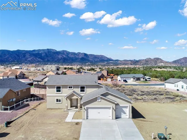 an aerial view of residential houses and outdoor space