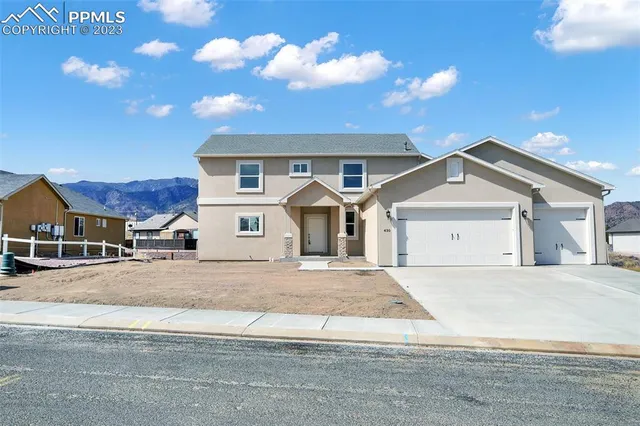 a view of a dining room with furniture wooden floor and chandelier