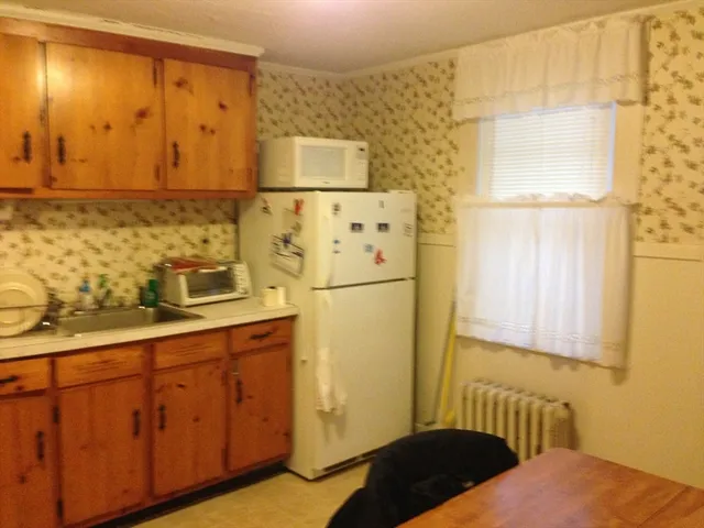 a bedroom with a bed and cabinets