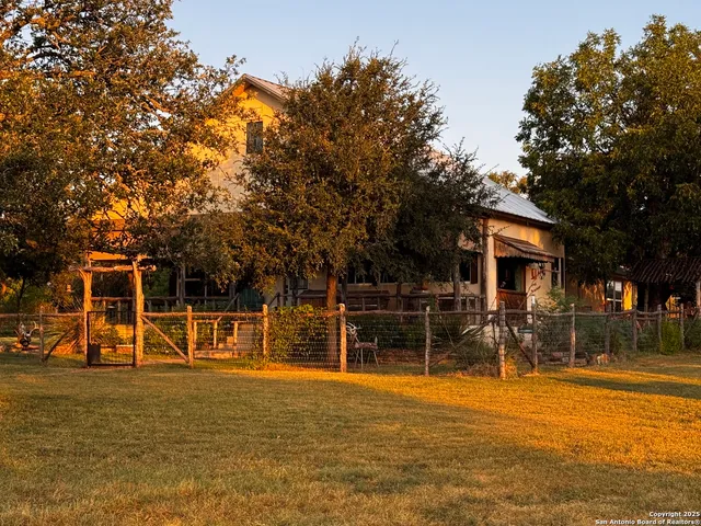 a front view of a building with a big yard