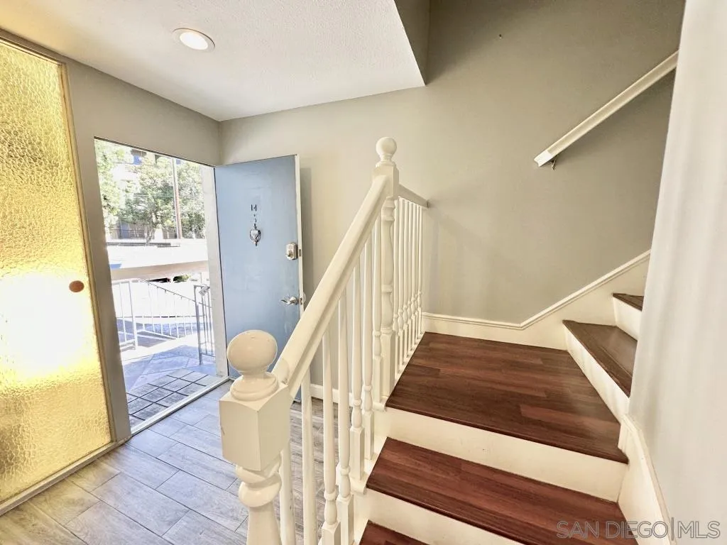 6855 Friars Road, Unit 14 San Diego, CA 92108 - Photo 17 of 31 a view of entryway and hall with wooden floor