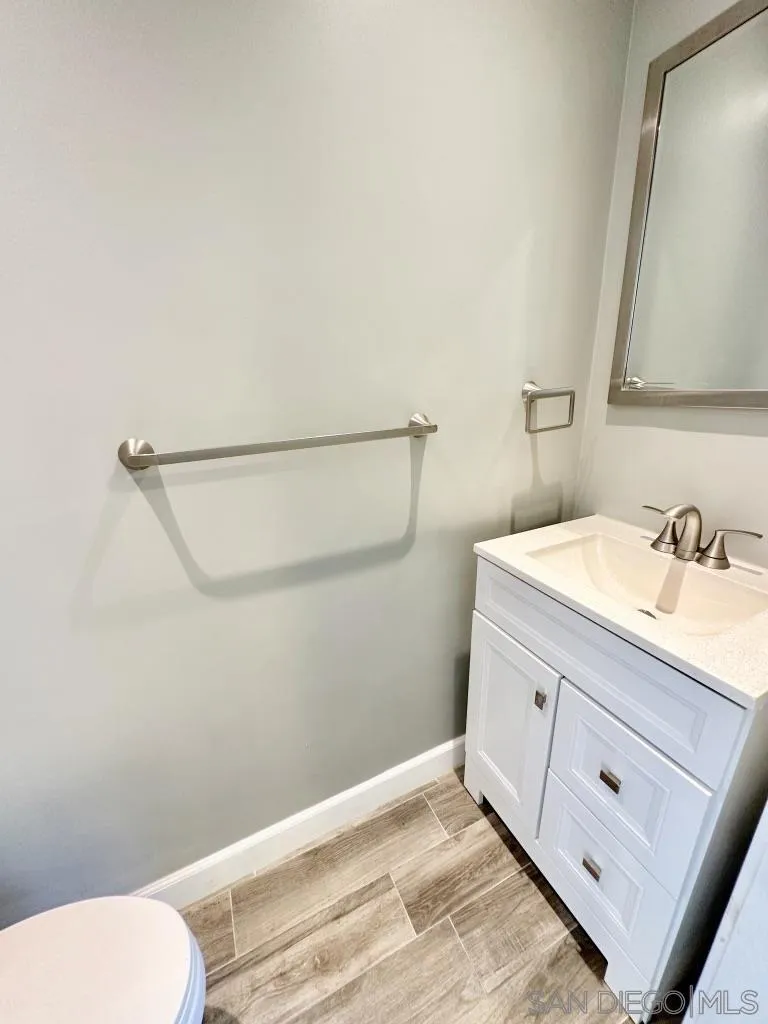 6855 Friars Road, Unit 14 San Diego, CA 92108 - Photo 28 of 31 a bathroom with a sink and a mirror