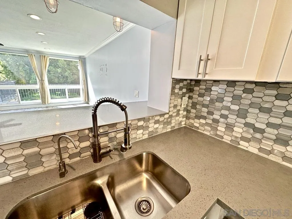 6855 Friars Road, Unit 14 San Diego, CA 92108 - Photo 30 of 31 a close view of a sink and dishwasher in a kitchen