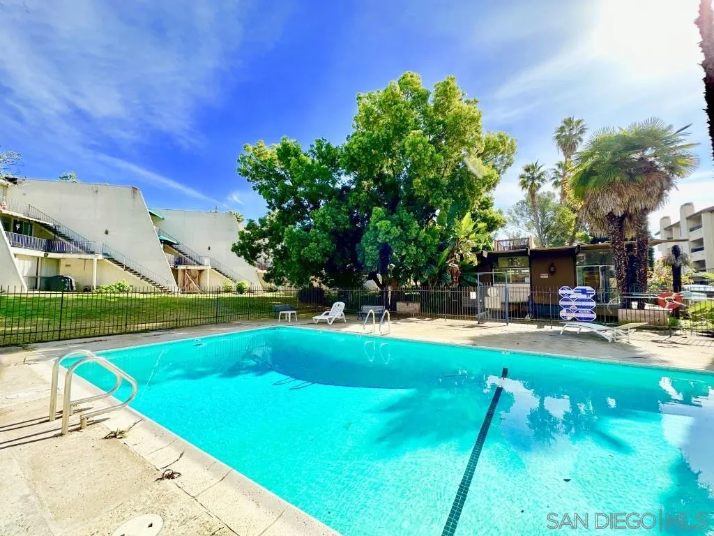 6855 Friars Road, Unit 14 San Diego, CA 92108 - Photo 31 of 31 a view of a swimming pool with lounge chairs
