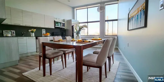 a dining room with furniture and window