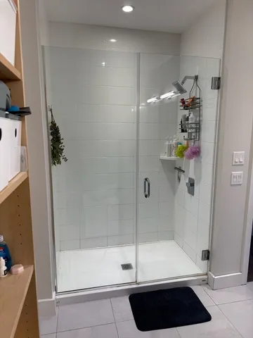 a bathroom with a bathtub and a shower