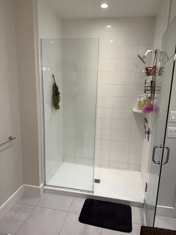 a bathroom with a bathtub and a shower
