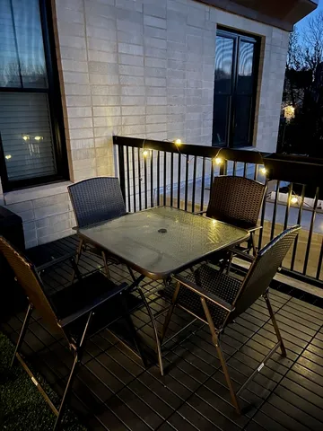 a view of a balcony dining area