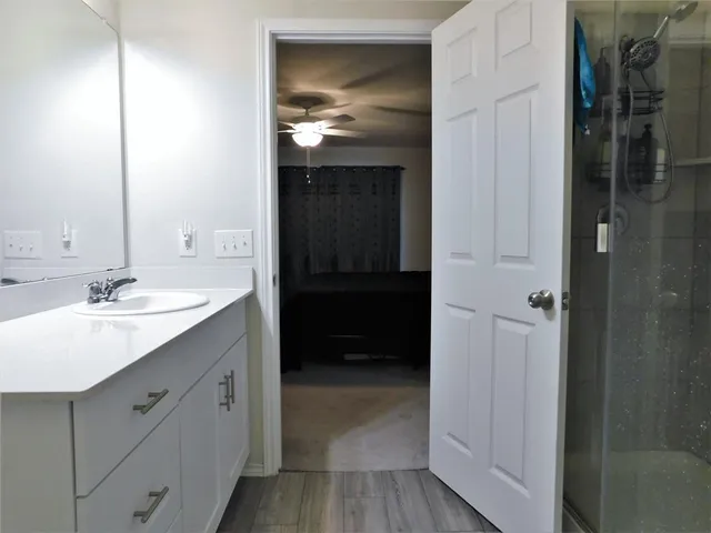 a bathroom with a sink and a mirror