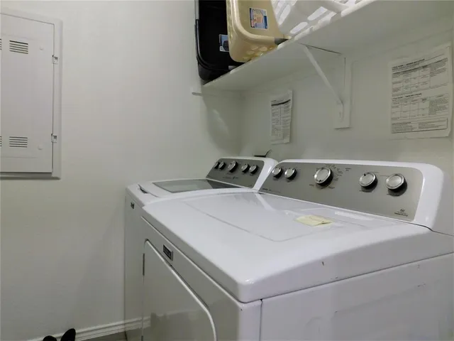 a utility room with dryer and washer
