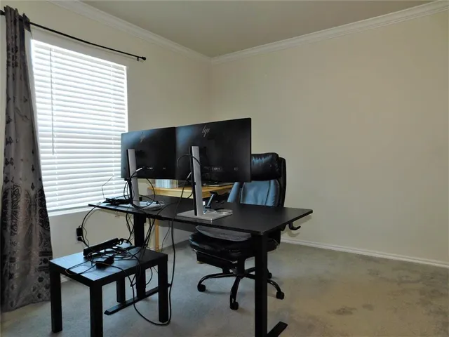 a work room with furniture and a window