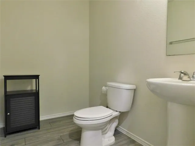 a bathroom with a toilet and a sink