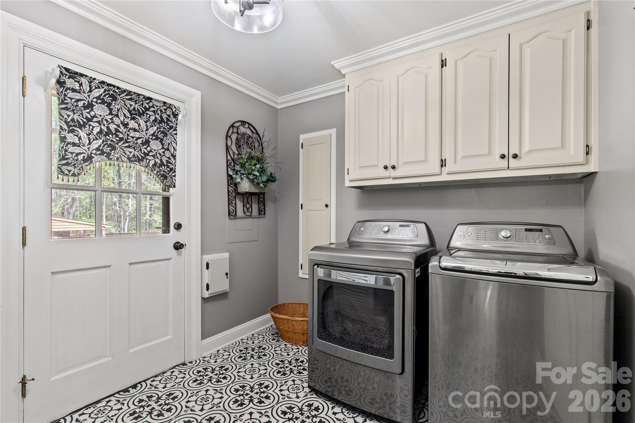 529 Langley Road Lancaster, SC 29720 - Photo 26 of 48 a kitchen with stainless steel appliances granite countertop a stove a washer and dryer