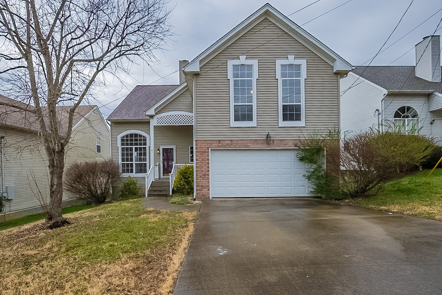 1008 Ridge Trail Goodlettsville, TN 37072 - Photo 1 of 21 a front view of a house with a yard and garage