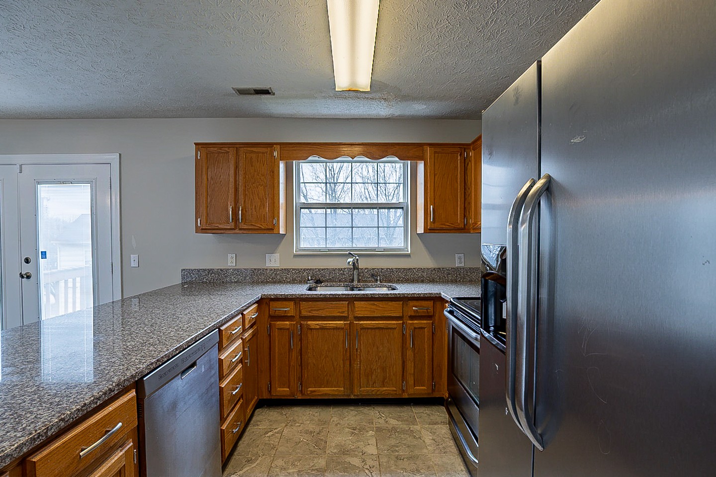 1008 Ridge Trail Goodlettsville, TN 37072 - Photo 4 of 21 a kitchen that has a sink a window and stainless steel appliances