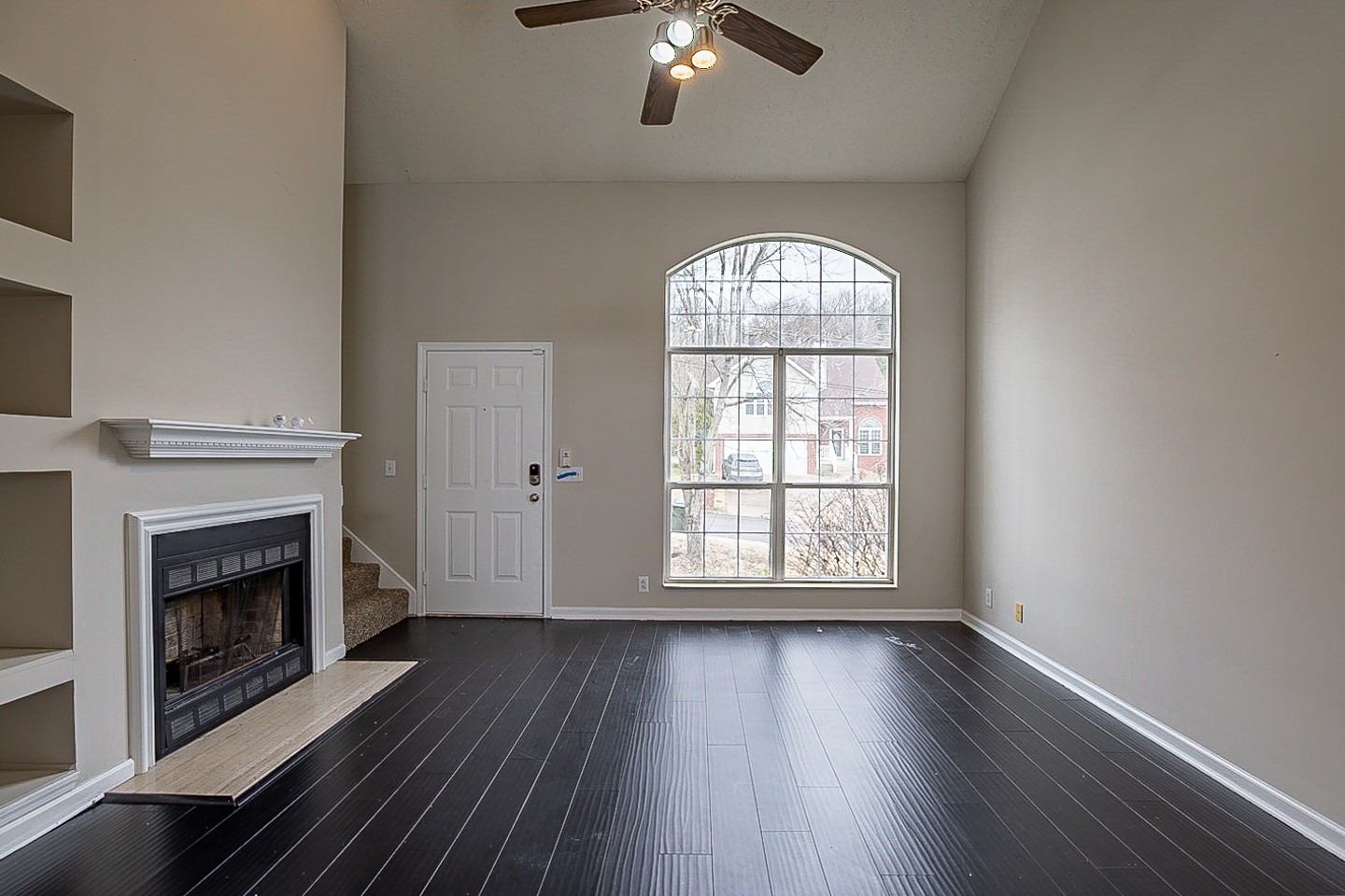 1008 Ridge Trail Goodlettsville, TN 37072 - Photo 5 of 21 an empty room with windows fireplace and wooden floor