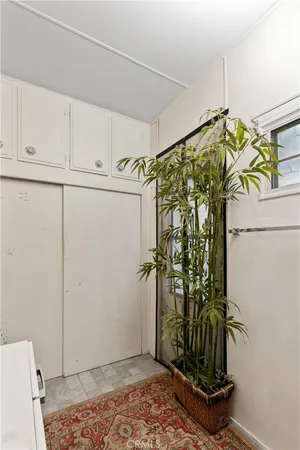 a work room with furniture and a window