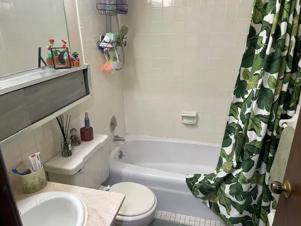 a bathroom with a toilet sink and tub