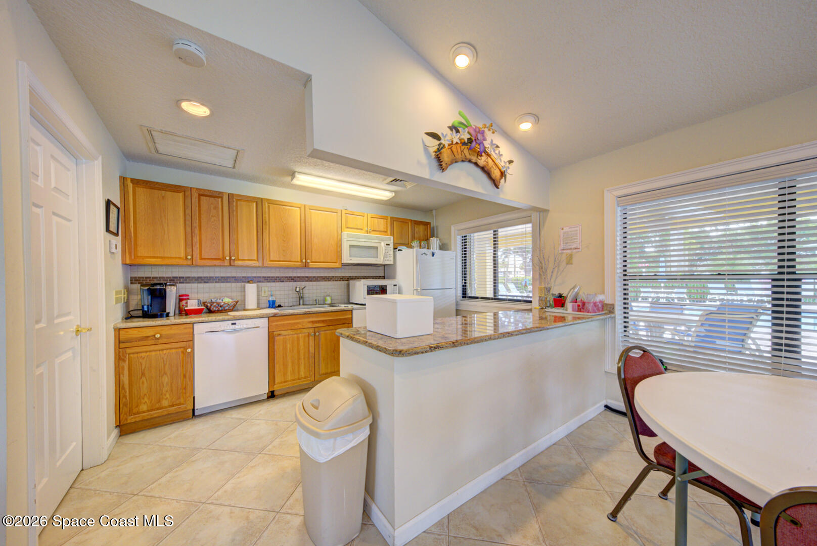 1142 Keystone Drive, Unit F Jupiter, FL 33458 - Photo 36 of 43 community clubhouse kitchen