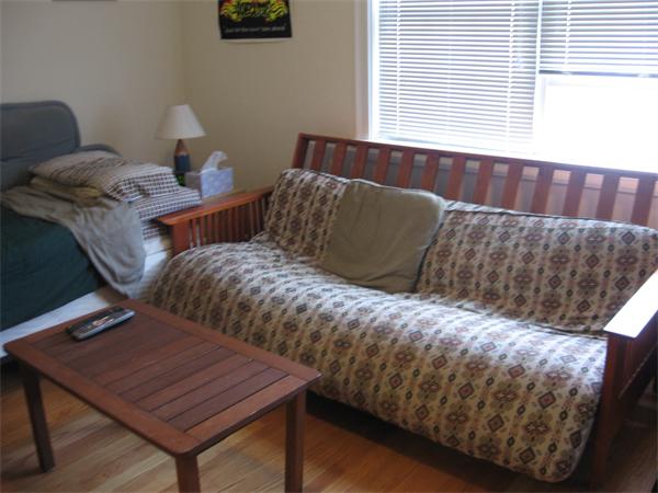 223 Robbins Street, Unit 1 Waltham, MA 02453 - Photo 12 of 12 a bedroom with a bed and window