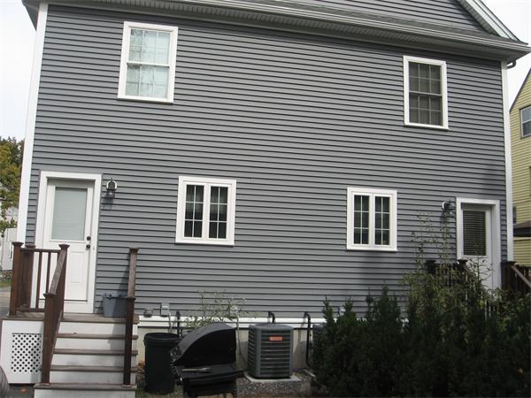 223 Robbins Street, Unit 1 Waltham, MA 02453 - Photo 3 of 12 a view of a house that has a window on th house