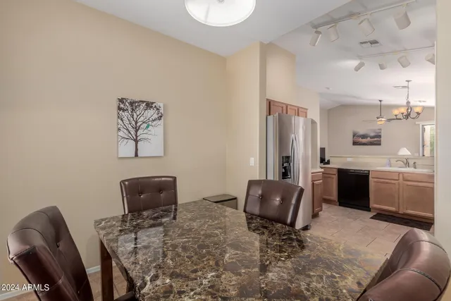 a kitchen with a stove microwave and a dining table