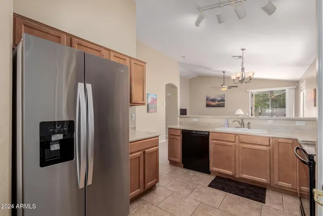 a bedroom with a bed and a television