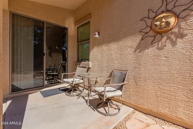 a view of a swimming pool with a sitting area