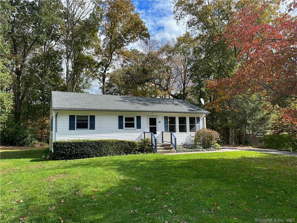 62 Manor Road Montville, CT 06370 - Photo 1 of 1 a front view of house with yard and green space