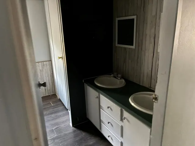 a bathroom with sink and mirror