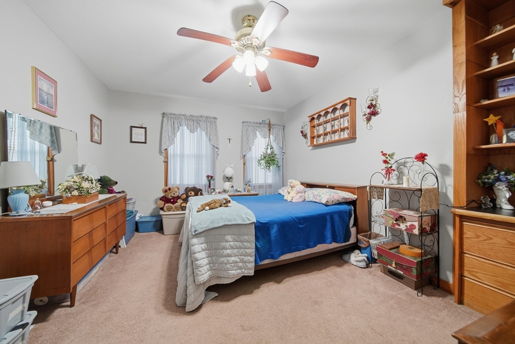 436 Franklin Road Fitchburg, MA 01420 - Photo 13 of 41 a bedroom with furniture and a baby crib