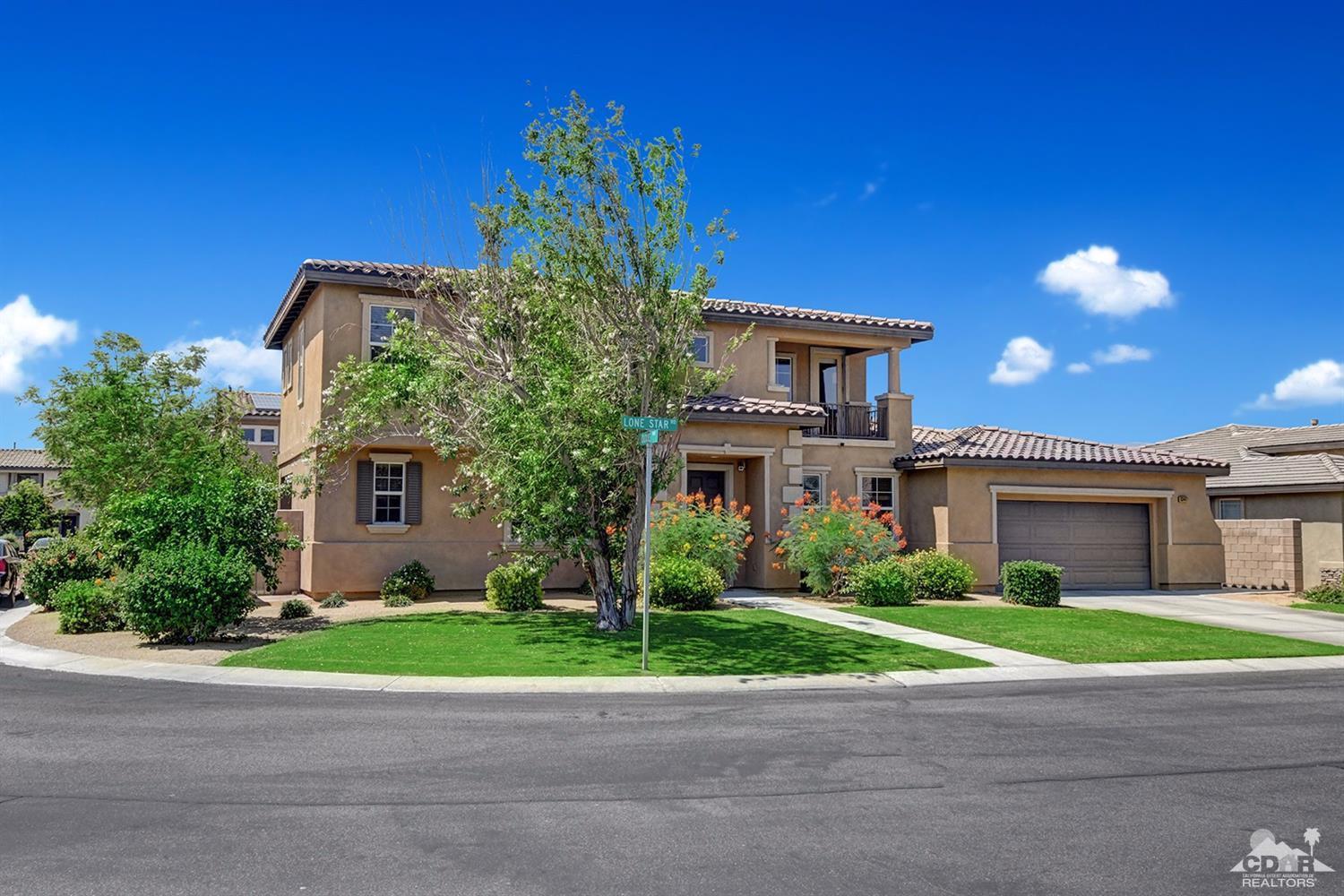 83447 Lone Star Road Indio, CA 92203 - Photo 1 of 47 a house that has a tree in front of it