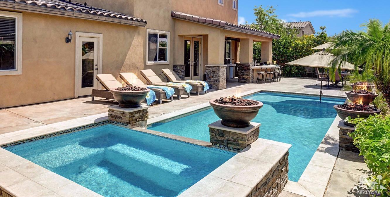 83447 Lone Star Road Indio, CA 92203 - Photo 2 of 47 a view of a house with backyard porch and sitting area