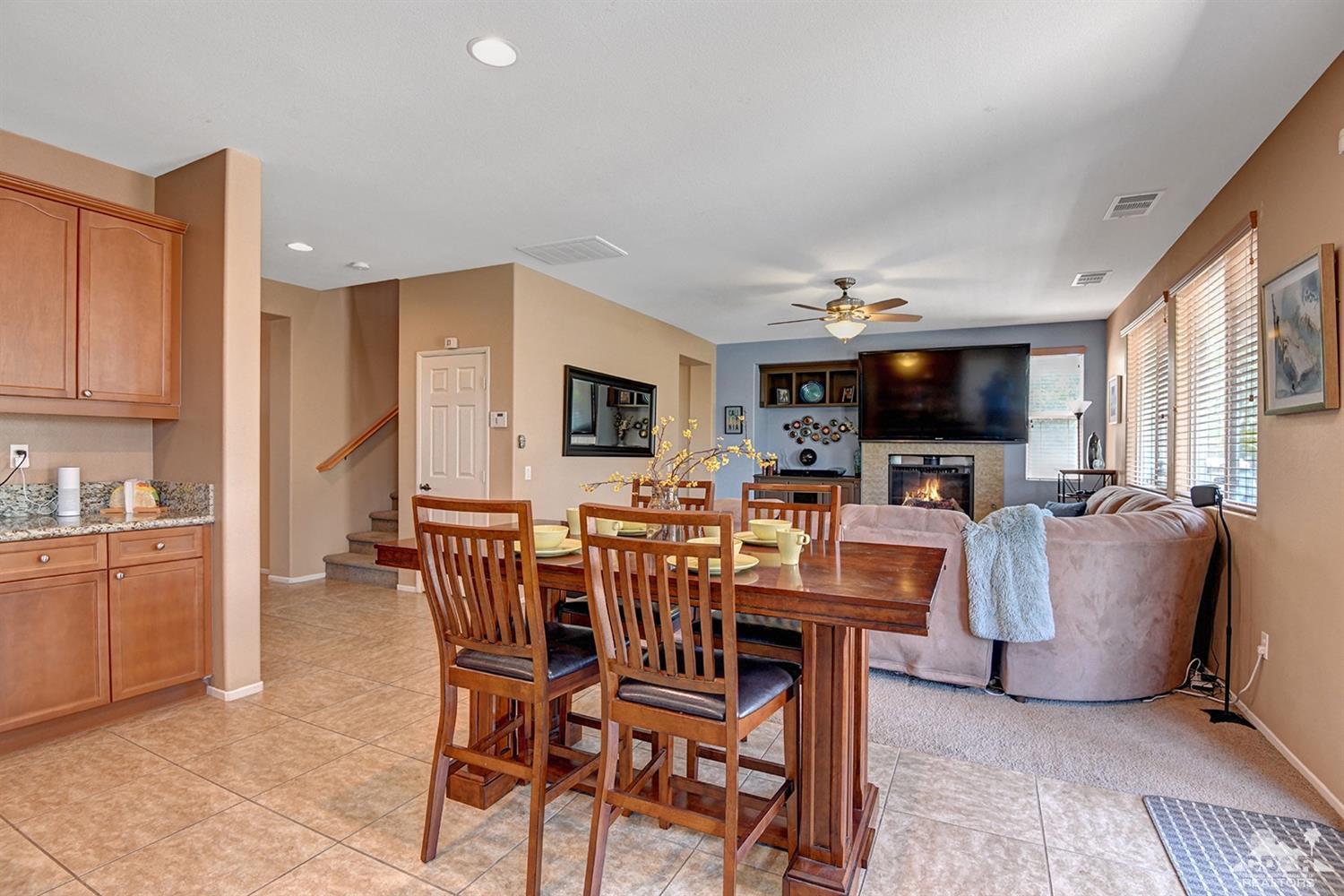 83447 Lone Star Road Indio, CA 92203 - Photo 12 of 47 a view of kitchen with furniture and flat screen tv