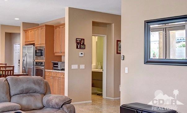 83447 Lone Star Road Indio, CA 92203 - Photo 17 of 47 a living room with furniture and a window
