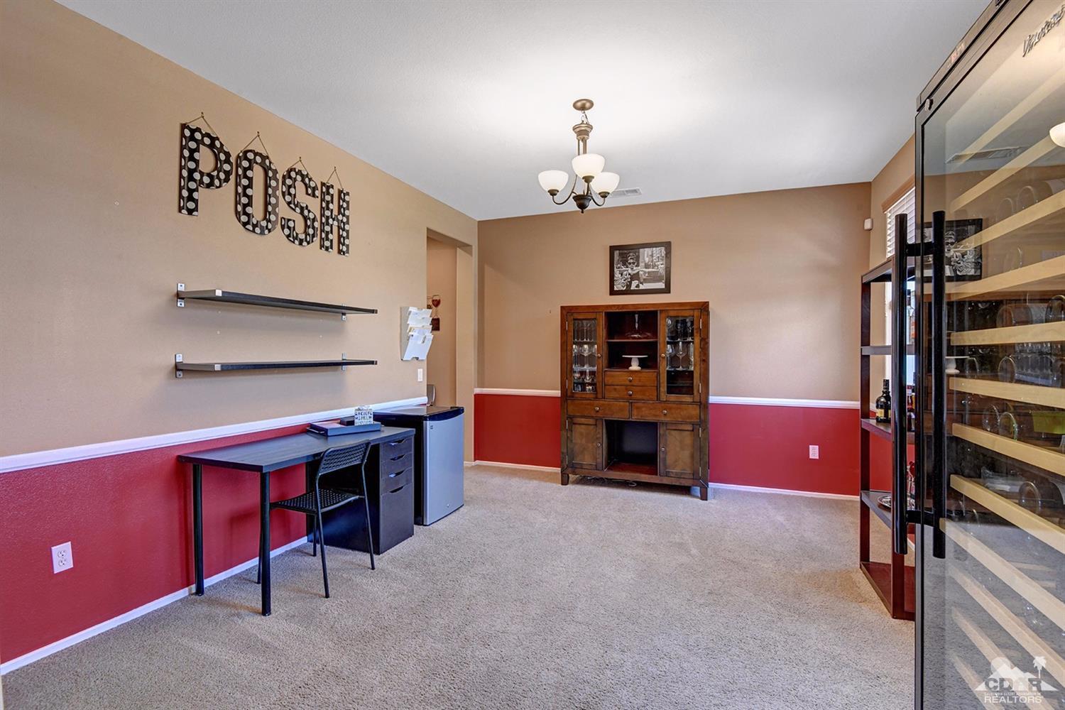 83447 Lone Star Road Indio, CA 92203 - Photo 20 of 47 a living room with furniture and a flat screen tv