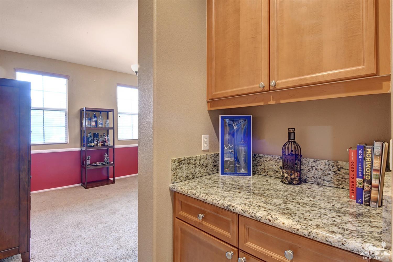 83447 Lone Star Road Indio, CA 92203 - Photo 21 of 47 a kitchen with stainless steel appliances granite countertop a sink and cabinets