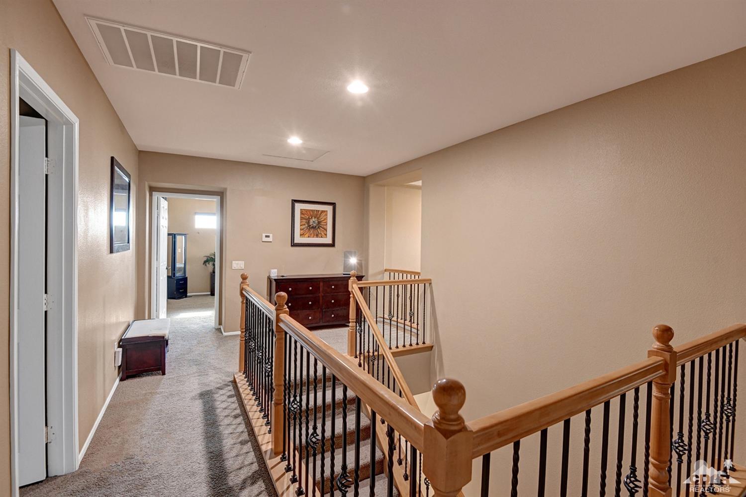 83447 Lone Star Road Indio, CA 92203 - Photo 27 of 47 a view of a hallway with workspace