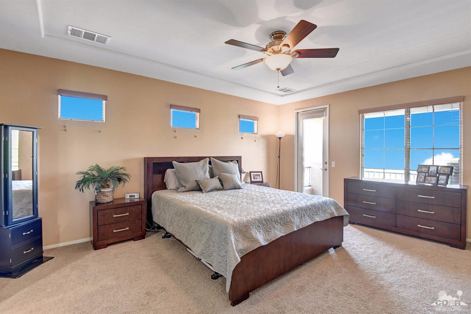 83447 Lone Star Road Indio, CA 92203 - Photo 28 of 47 a bedroom with a large bed and a window