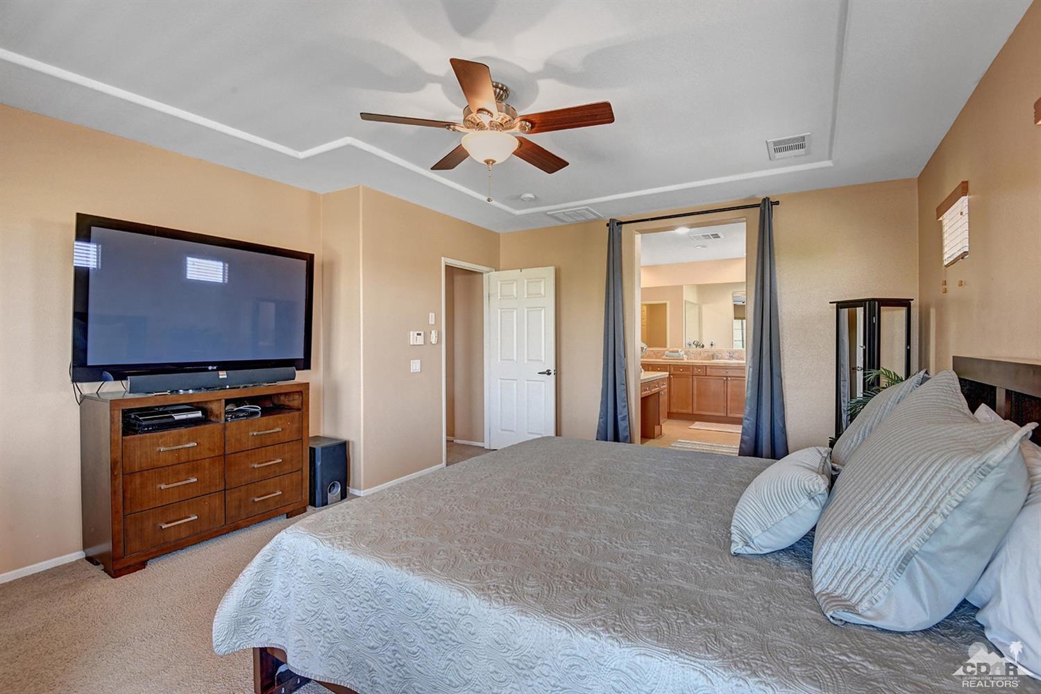 83447 Lone Star Road Indio, CA 92203 - Photo 33 of 47 a bedroom with a bed and a television