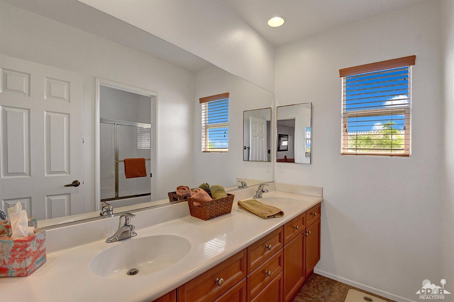 83447 Lone Star Road Indio, CA 92203 - Photo 36 of 47 a bathroom with a sink and a mirror