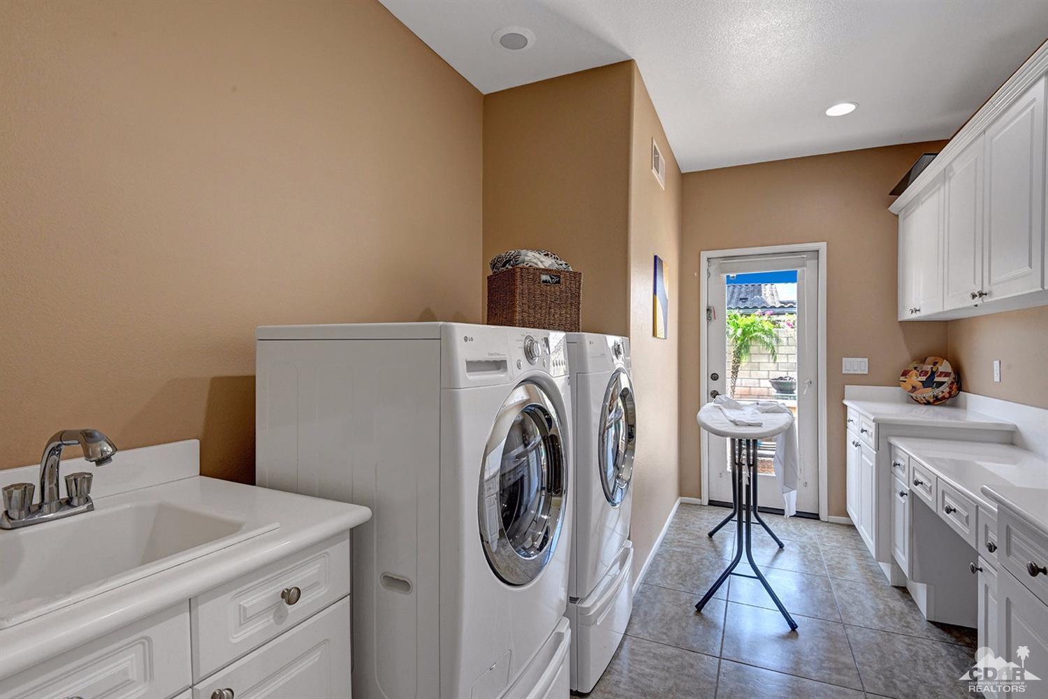 83447 Lone Star Road Indio, CA 92203 - Photo 39 of 47 a utility room with sink dryer and washer