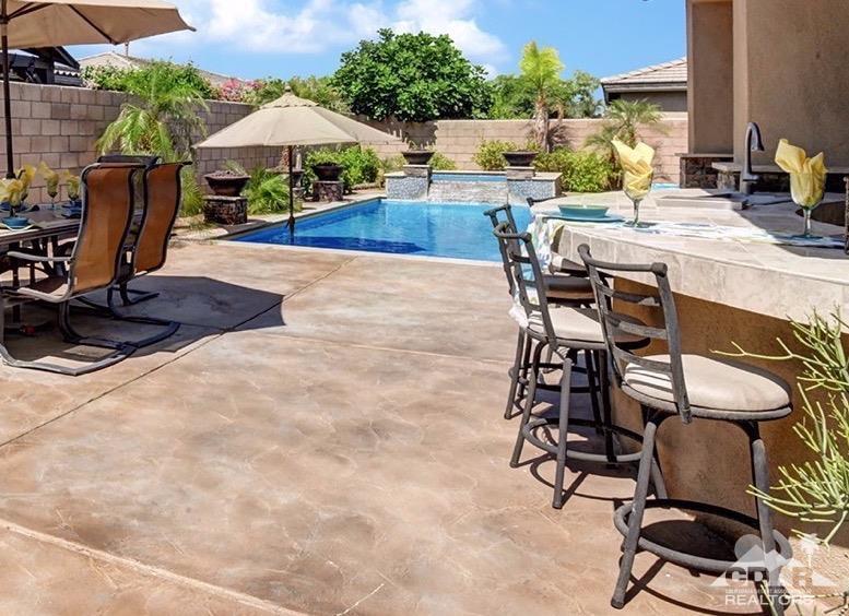 83447 Lone Star Road Indio, CA 92203 - Photo 5 of 47 a view of a backyard with sitting area and furniture