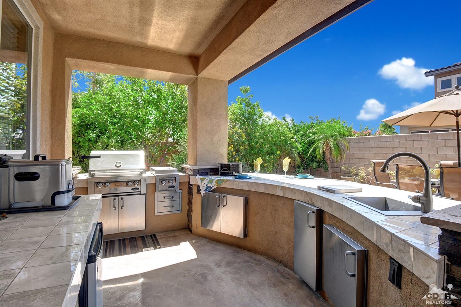83447 Lone Star Road Indio, CA 92203 - Photo 44 of 47 a kitchen with a sink stove and cabinets