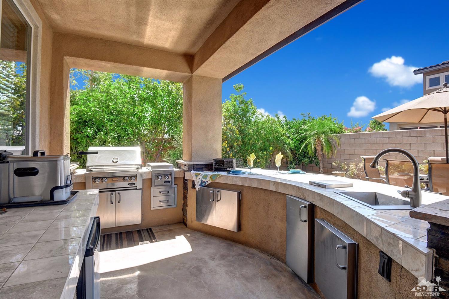 83447 Lone Star Road Indio, CA 92203 - Photo 6 of 47 a kitchen with a sink stove and cabinets