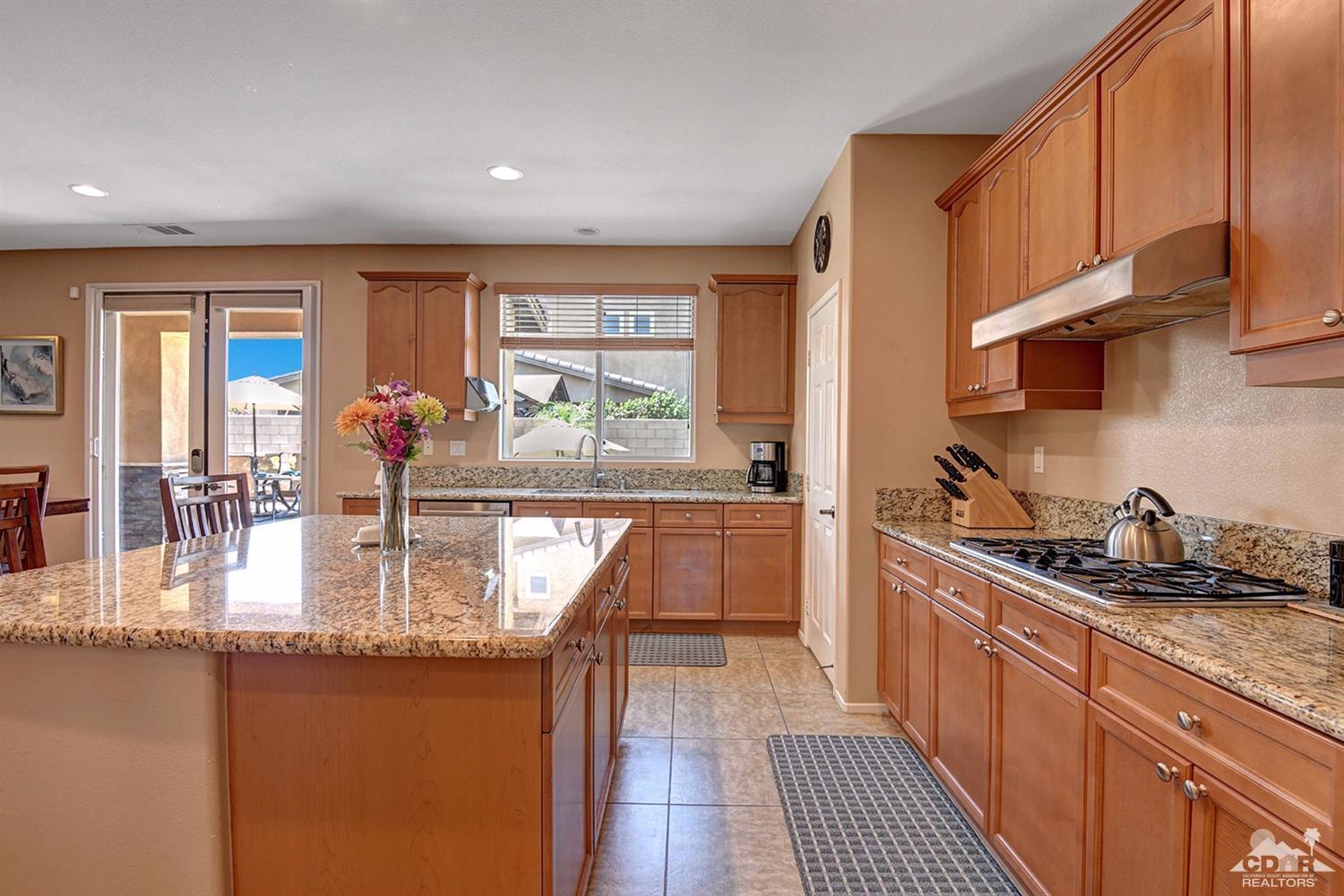 83447 Lone Star Road Indio, CA 92203 - Photo 9 of 47 a kitchen with sink a counter top space and cabinets