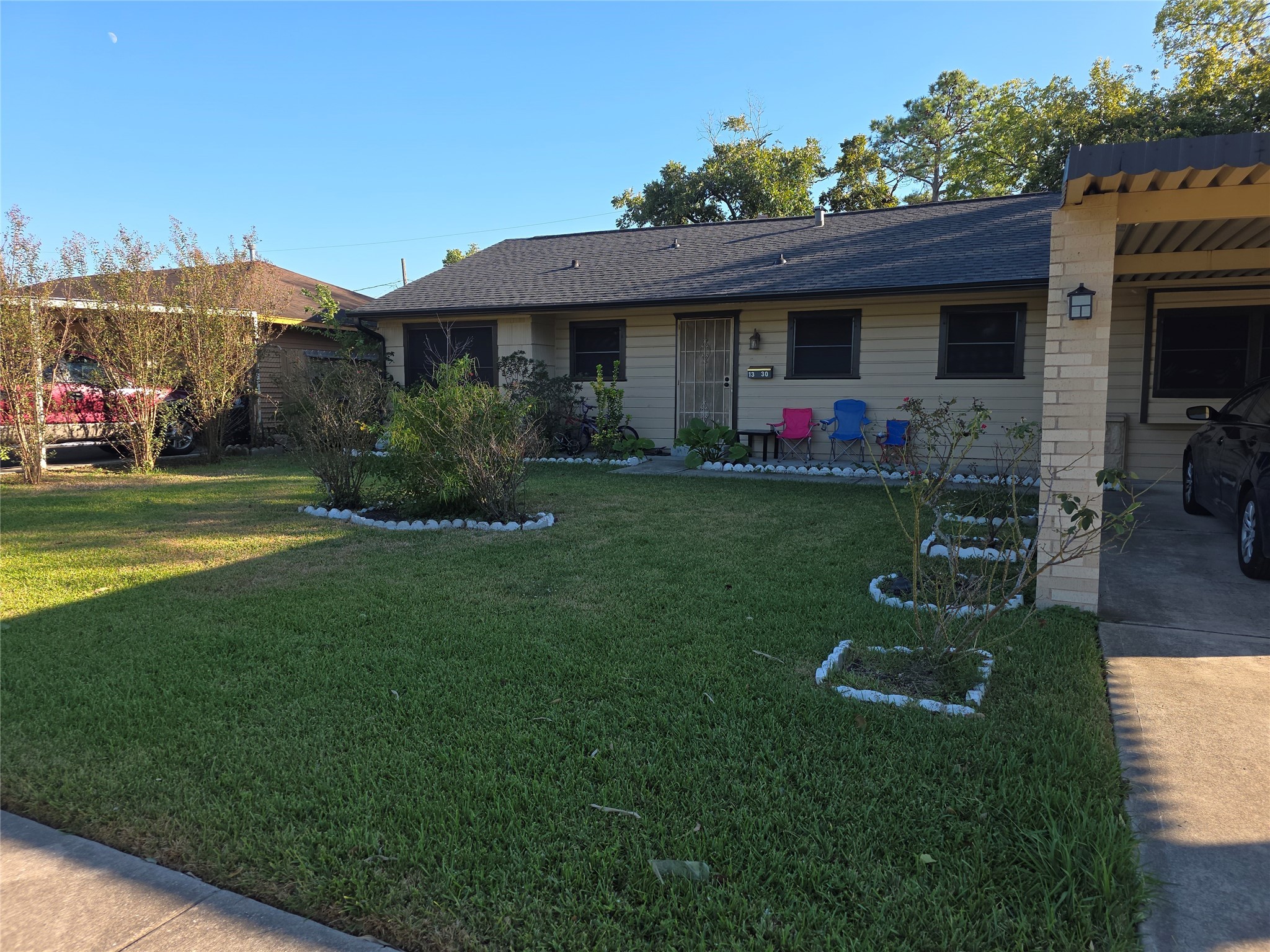 a front view of a house with garden