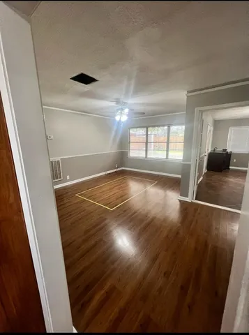 a view of an empty room and window